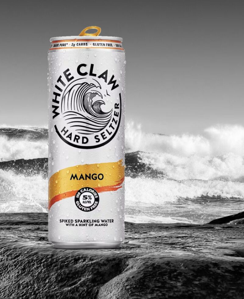 A can of White Claw Hard Seltzer Mango at the beach