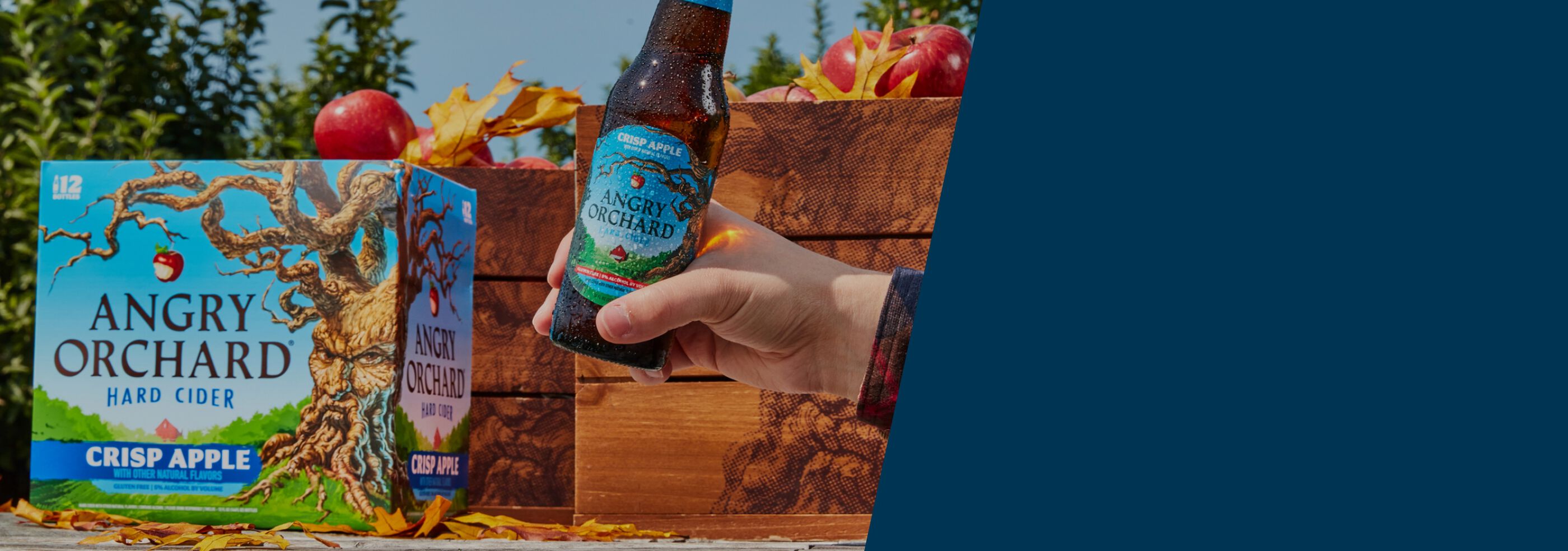 Bottle and case of Angry Orchard with apples