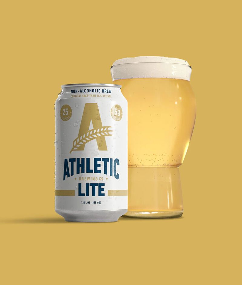 A can of Athletic Brewing Company Athletic Lite with a glass