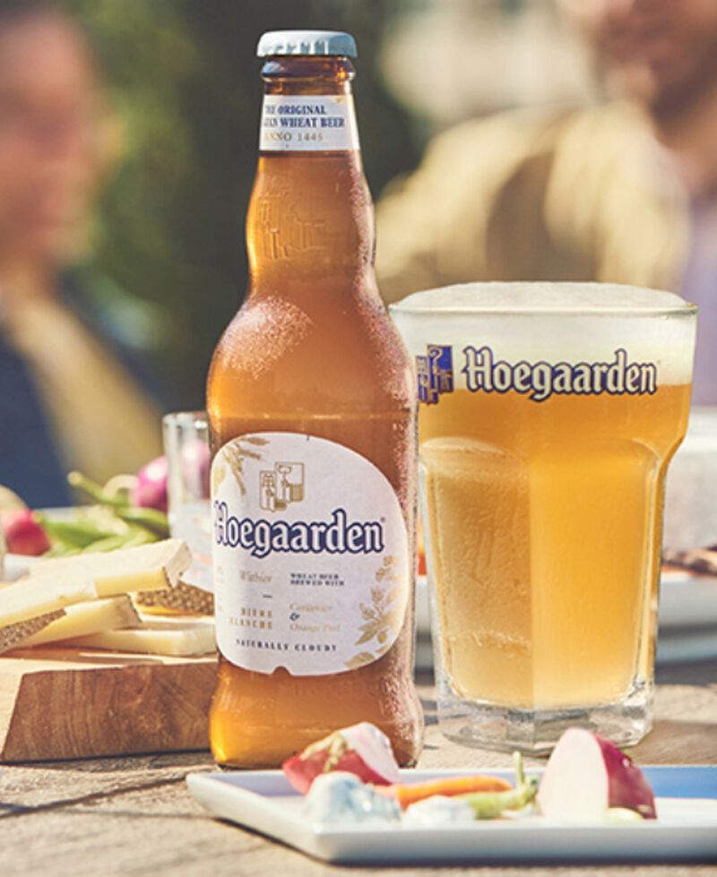 Bottle of Hoegaarden with a glass and lunch
