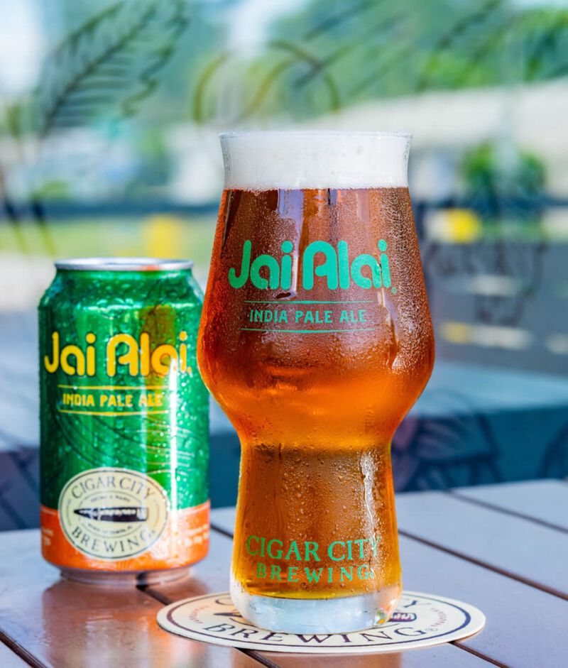A can of Cigar City Jai Alai with a glass