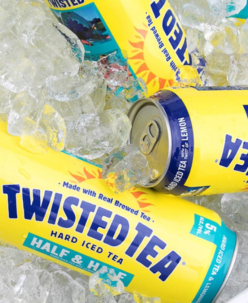 Cans from a Twisted Tea Variety Party Pack Hard Iced Tea on ice